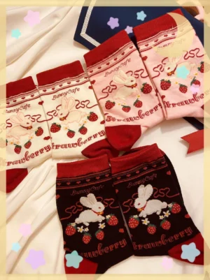 Strawberry bunny kawaii lolita socks flat lay display showing all color variants pink cream off-white black with cute print designs