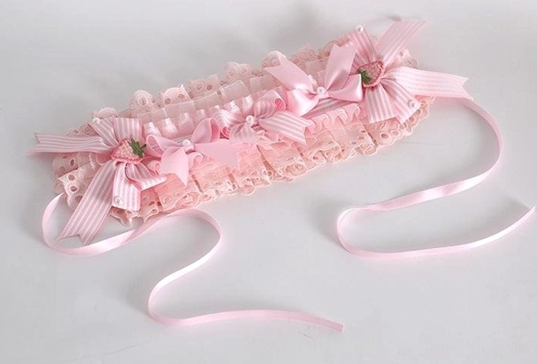 Lolita strawberry lace headband with scalloped pink ruffled lace small bows strawberry charms and long adjustable pink straps white background