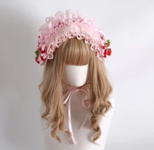 Lolita strawberry scalloped lace headband with adjustable back ribbon and strawberry charms front view on mannequin