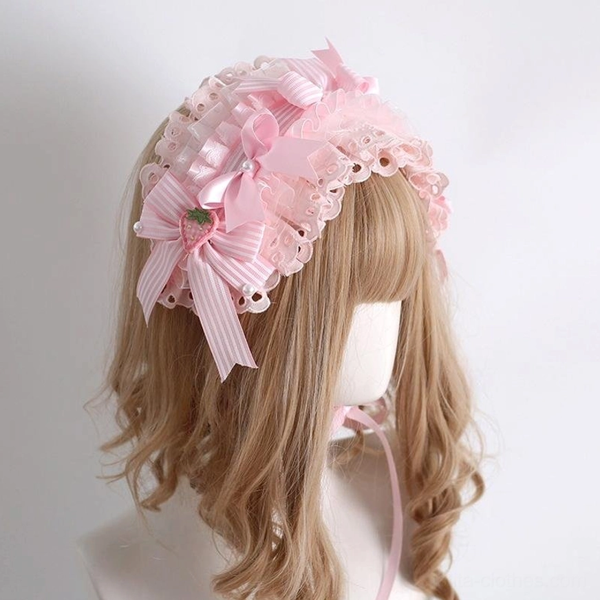 Lolita strawberry side hair bow with scalloped pink ruffled lace bow and strawberry charm adjustable back strap right angle