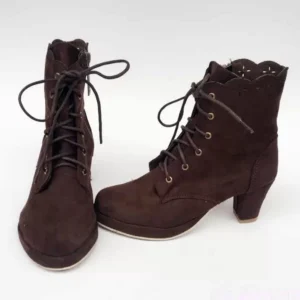 Lolita Chelsea boots side three-quarter angle showcasing functional side zipper closure, scalloped topline edge detail, and overall silhouette profile in coffee brown suede