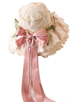 Flat lay top view of adjustable lolita sunshade hat displaying beige lace construction, central satin bow with long ribbons, and coordinating pearl chain embellishments without mannequin