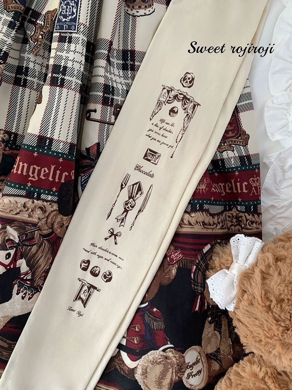 Flat lay top down view cream white lolita stockings vintage letter prints tableware teddy bear prop sweet rojiroji branded display