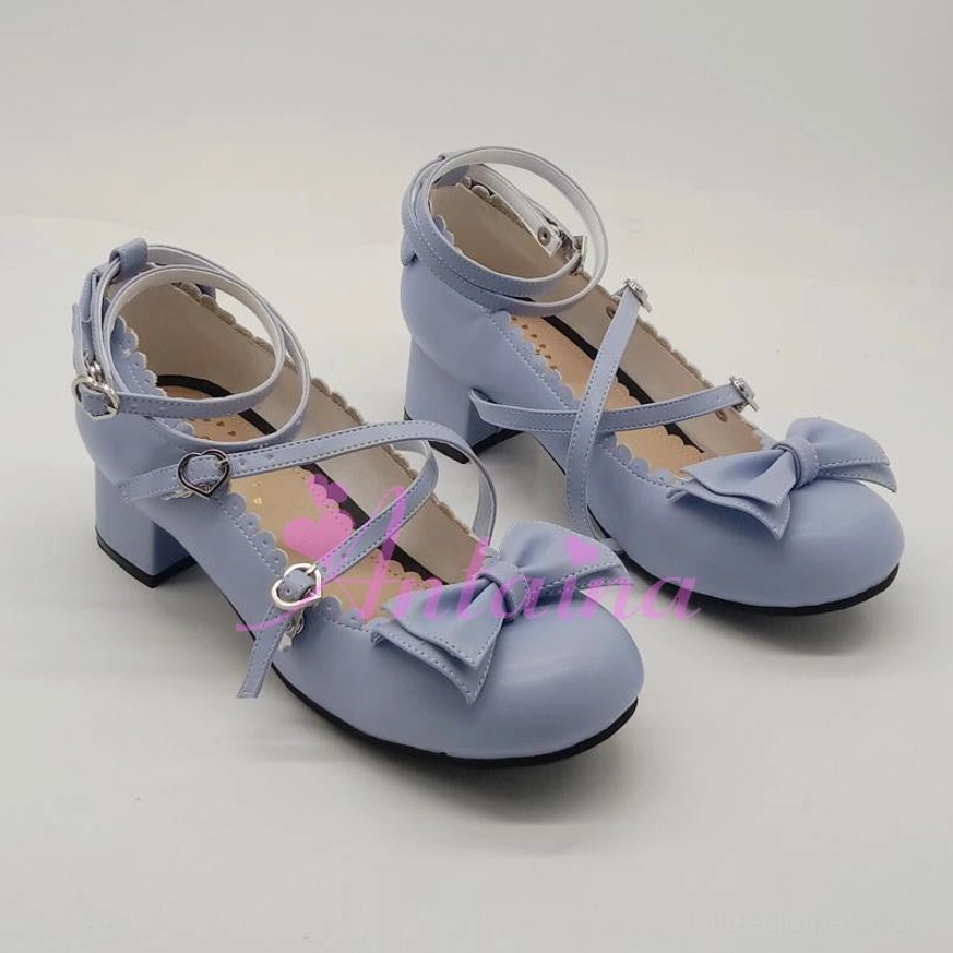 Dusty blue matte leather lolita tea party shoe featuring crossover buckle strap, toe cap bow decoration, and low block heel in side angle