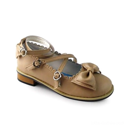 Matte apricot colored lolita tea party shoe featuring round toe design, crossover strap with buckle, and decorative bow on toe cap