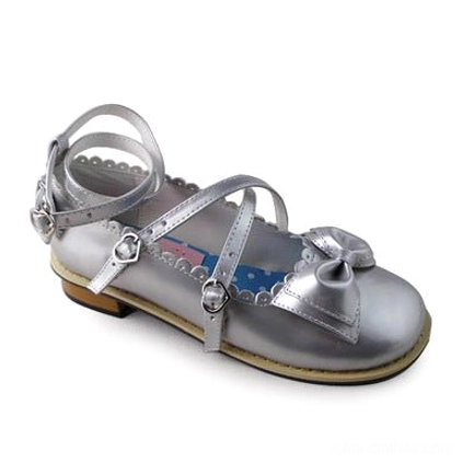 Silver metallic lolita tea party shoe with reflective shimmering finish, crossover buckle strap, round toe, and elegant bow ornament