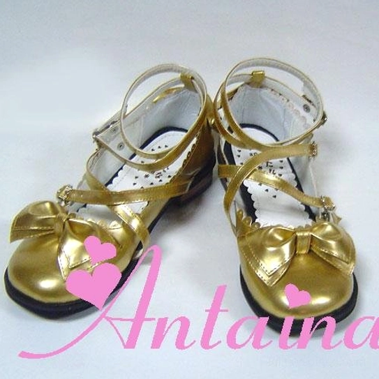 Lolita tea party shoes close-up detail heart-shaped buckle mechanism crisscross strap fastenings intricate design artisan craftsmanship precision