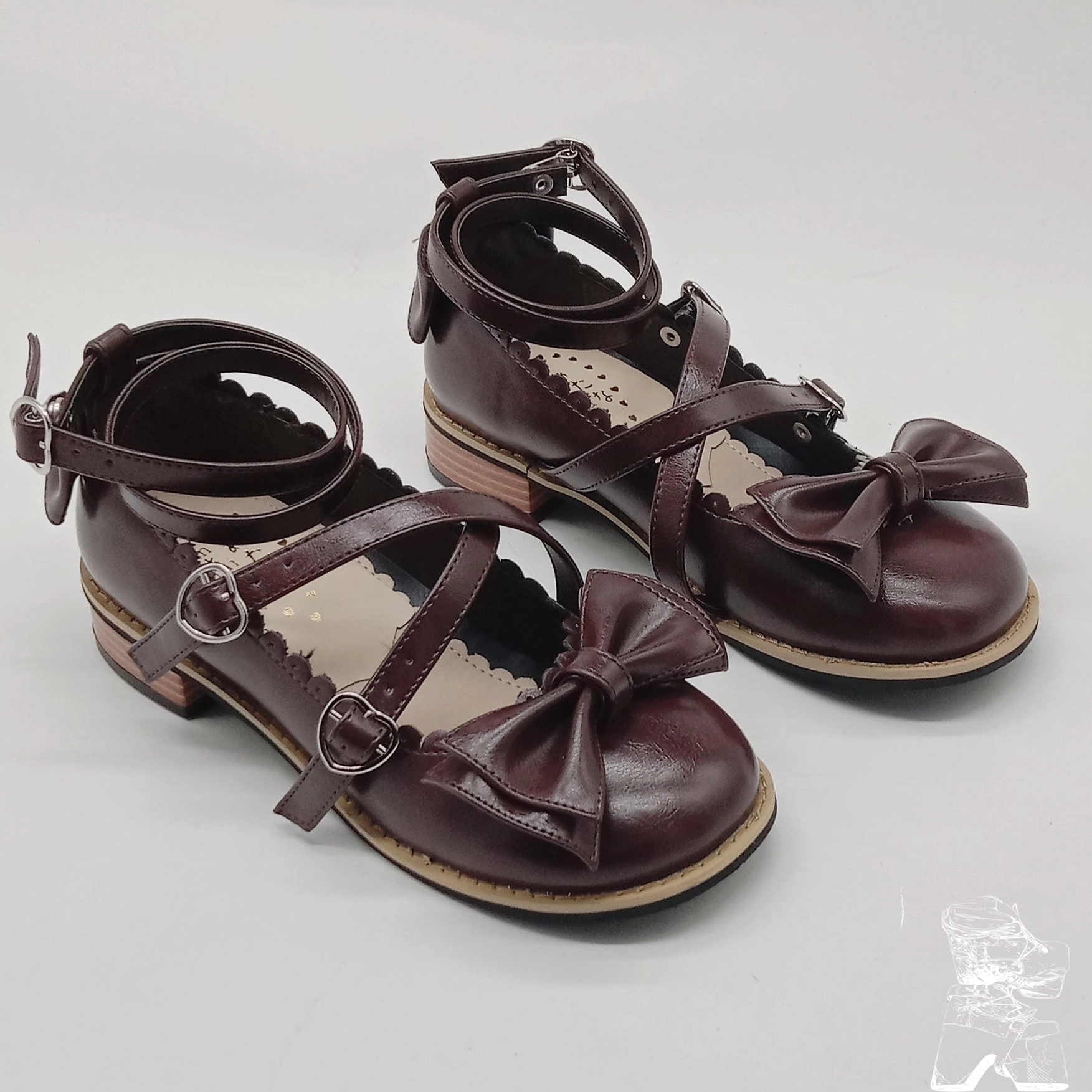 Dark brown matte leather Lolita tea party shoes front three-quarter display large toe bow crisscross straps heart buckles block heel stitching