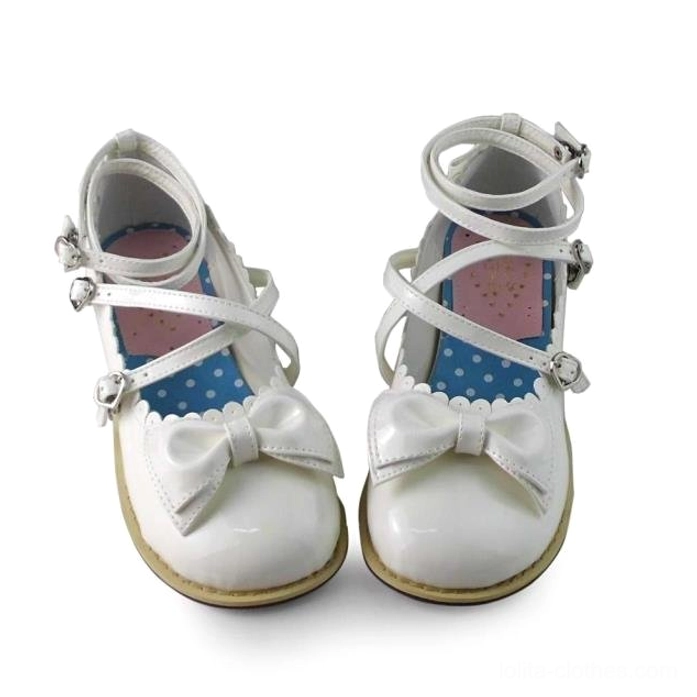 Lolita tea party shoes paired display showing left right shoe toe box shape crisscross strap symmetry heart buckles identical craftsmanship