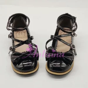 Elegant handcrafted lolita tea party shoes with round toe design, crossover ankle straps, and decorative bow ornament front view on white background