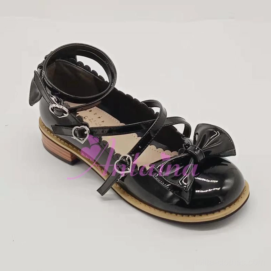 Handmade Lolita tea party shoes top view showing crisscross ankle strap layout heart buckle placement toe bow ornament positioning elegant design