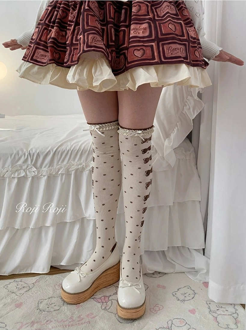 Sweet lolita thigh-high socks polka dots bow stripe pattern cream base red ruffled skirt beige platform loafers three-quarter front view shoe details