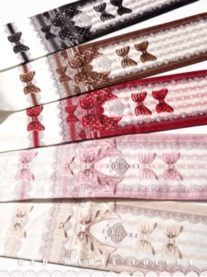 Complete colorway collection of reversible printed Lolita velvet pantyhose including cream yellow, honey pink, red and white, black and white, and chocolate brown options in flat lay display