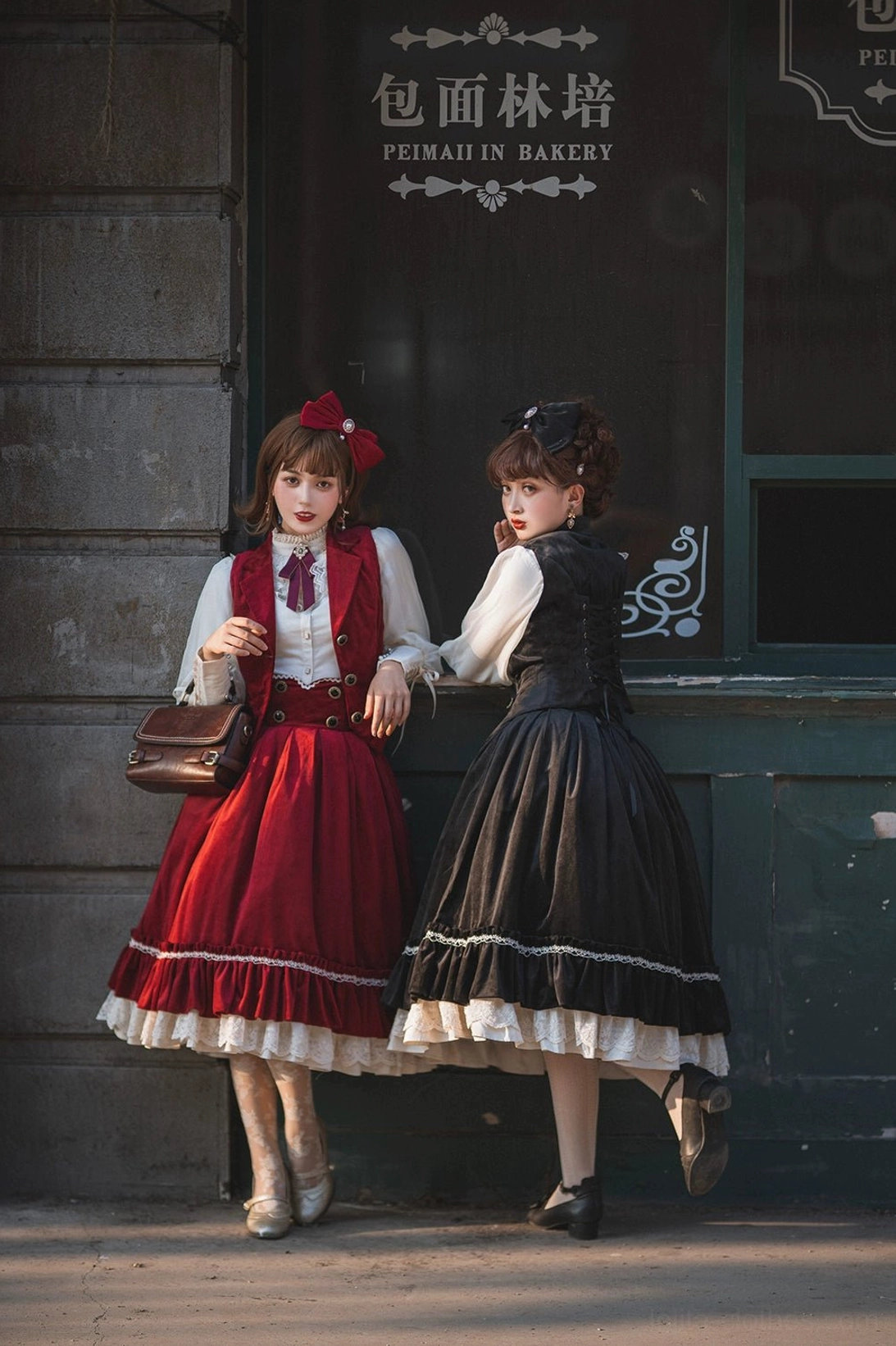Lolita girls walking in velvet waistcoat and skirt sets with white lace ruffled hems and sheer stockings