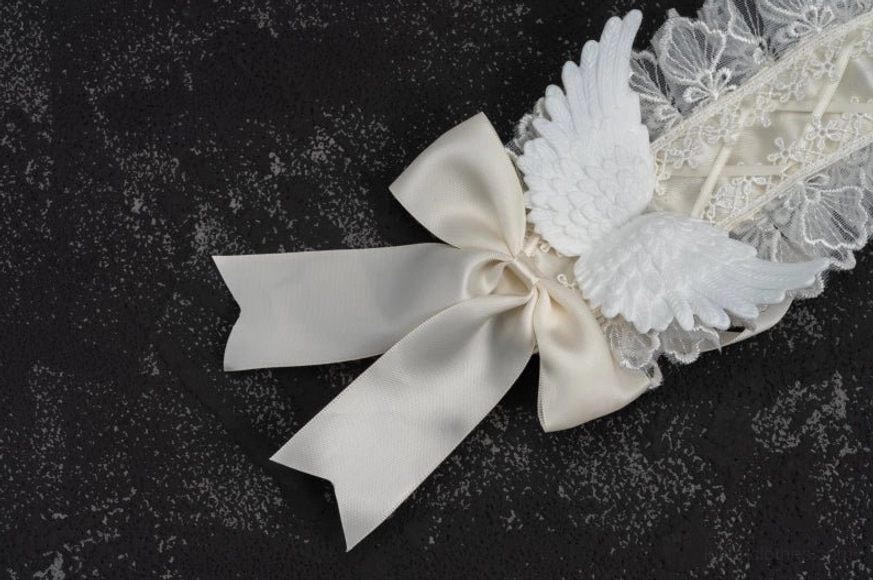 White lace gothic lolita angel wings hairband accessory paired with coordinating elements, demonstrating styling versatility for lolita fashion coordinates