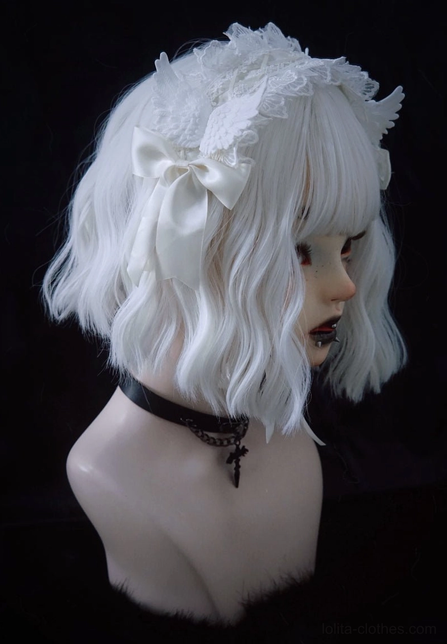 Gothic lolita white lace angel wings hairband right side three-quarter view displayed on BJD with white bob wig and cross choker, satin bow decoration visible