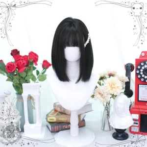 Shoulder-length straight Lolita wig front three-quarter angle view with neat blunt bangs, pure black synthetic hair, natural fall texture, accessorized with pearl hair clip demonstrating styling versatility
