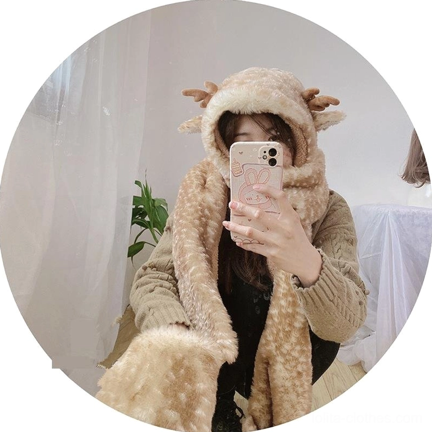 Lolita 3-in-1 plush winter set with antler design, light brown spotted fleece hood, integrated scarf and gloves, mirror selfie wearing in indoor room with curtain and green plant