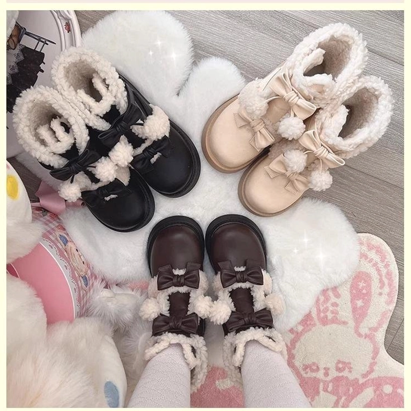 Assorted lolita winter boots in multiple color variants with bow details shearling cuffs and thick platform soles on bunny-themed plush rug
