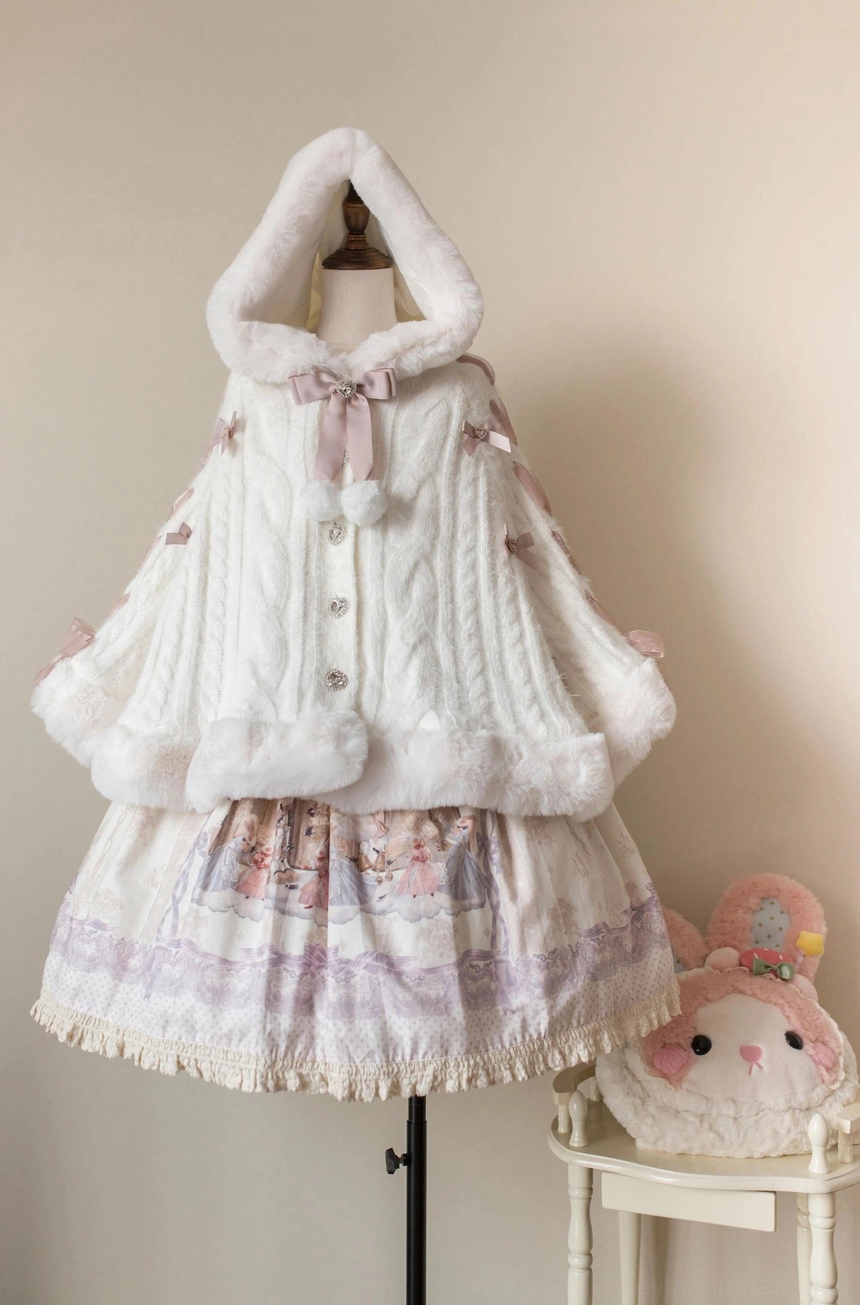 Lolita winter cape coat hood design showcasing adjustable hooded feature with bow collar, perfect for seasonal weather protection while maintaining aesthetic