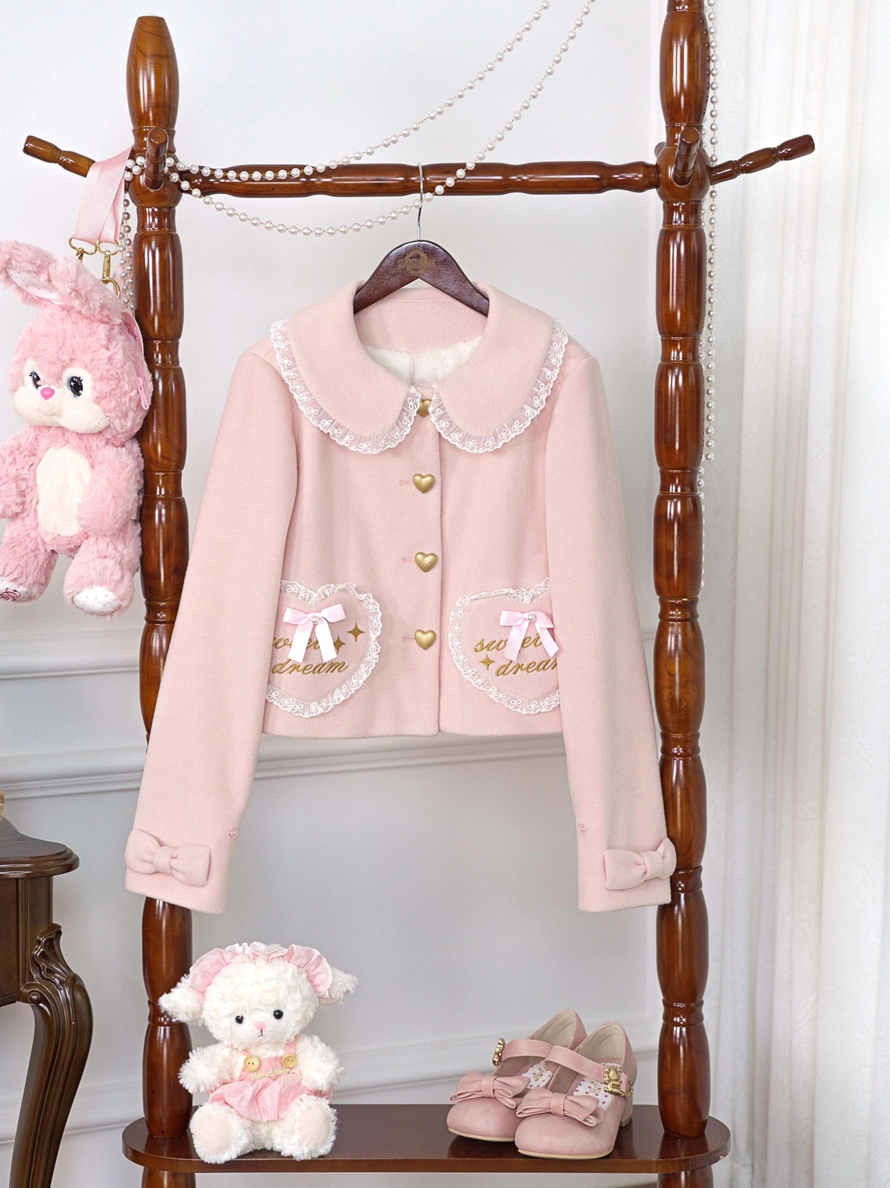 Lolita winter fleece coat showing construction detail of peter pan collar with lace trim and structured silhouette maintaining feminine elegant proportions