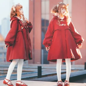 Lolita models in sweet lolita woolen winter outerwear with bishop sleeves and ruffled decorations mid-length A-line cut side standing view brick building background