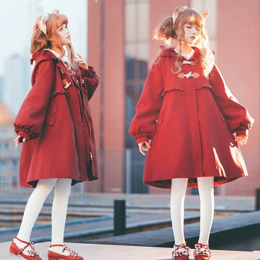 Lolita models in sweet lolita woolen winter outerwear with bishop sleeves and ruffled decorations mid-length A-line cut side standing view brick building background