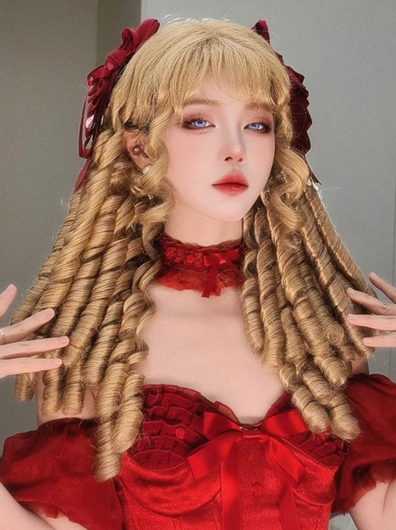Long lolita spiral curly synthetic wig in light golden brown with voluminous ringlets paired with gothic red dress
