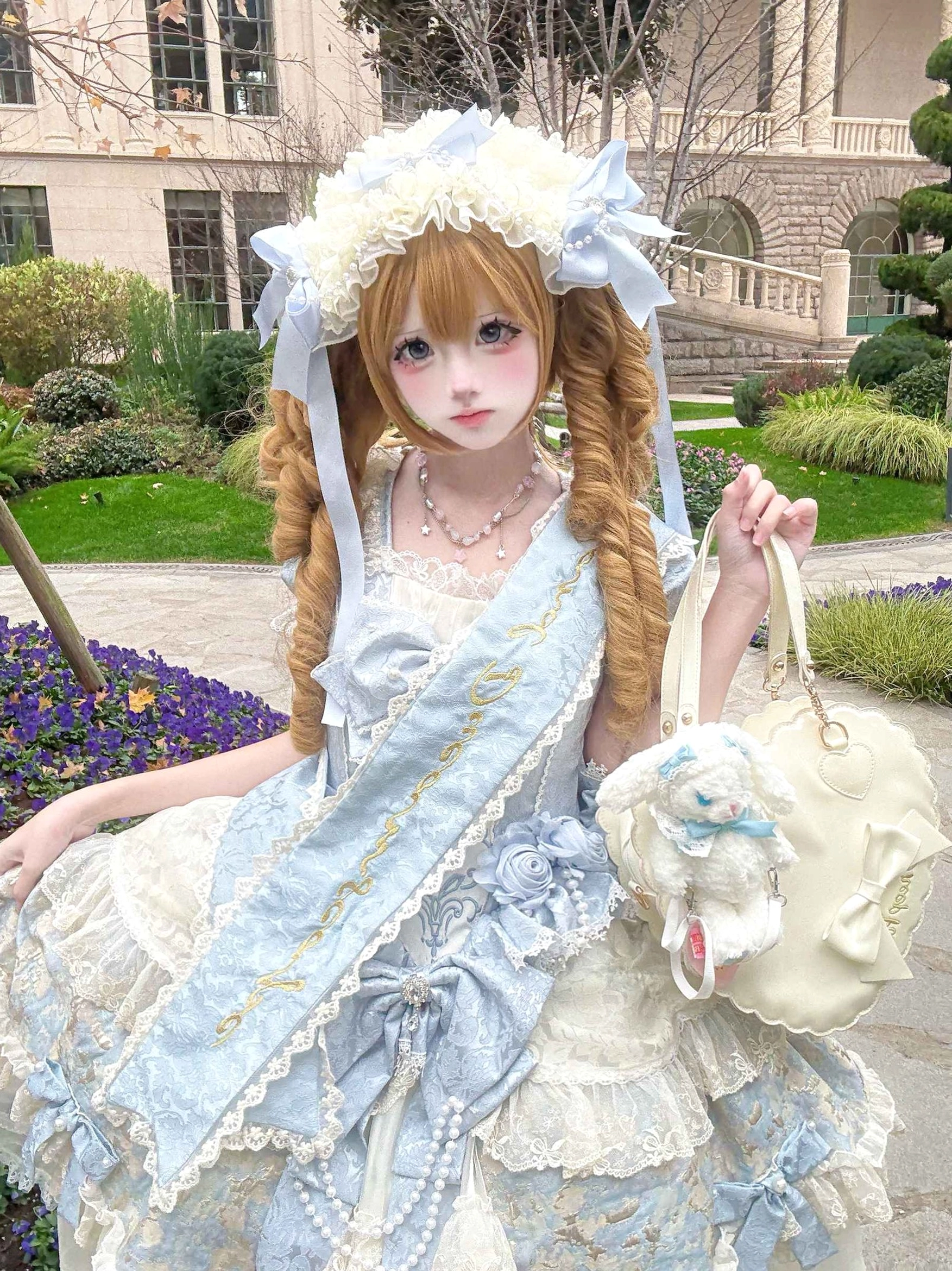 Luxury Lolita ball gown full-body side portrait blonde twin-tails girl outdoor European garden matching plush rabbit handbag pearl necklace lace bonnet