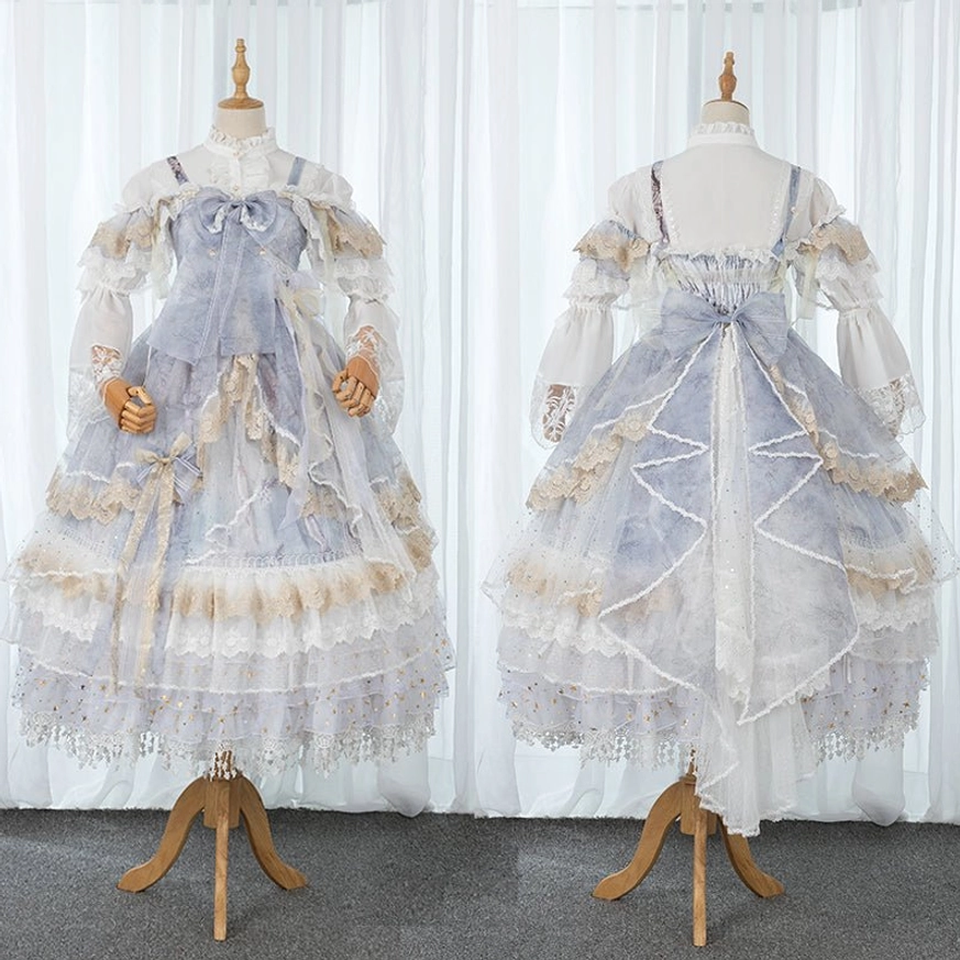 Luxury vintage lolita op dress front and back display showing pastel blue-gray with gold lace trim big back bow and ruffled multi-layered hem