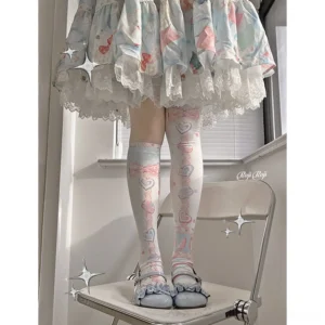 Close-up front view of pastel macaron printed sweet lolita over-the-knee stockings showing heart and candy design details