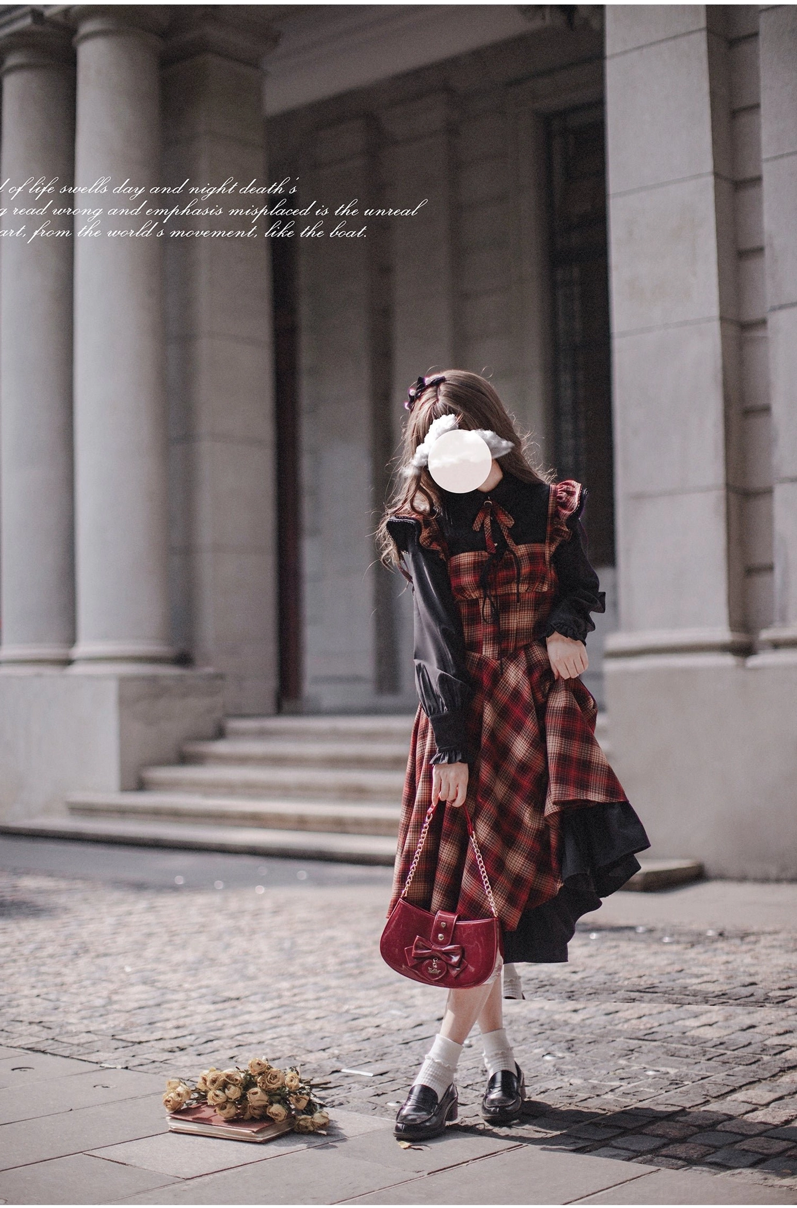 Madeleine lolita JSK suit with red plaid jumper skirt, black blouse, black wool coat with petal collar and double-breasted buttons - back view while walking with red handbag on European stone stairs
