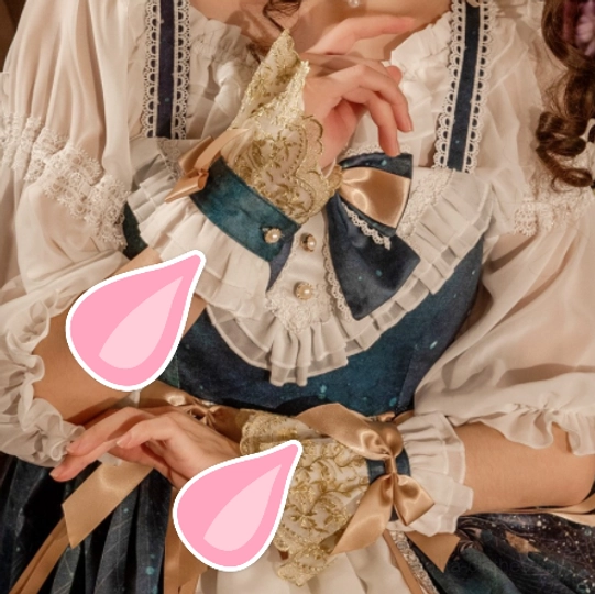 Lolita fashion cuffs worn on arm with model in vintage lolita dress gold lace and satin bow accessories matching coordinate