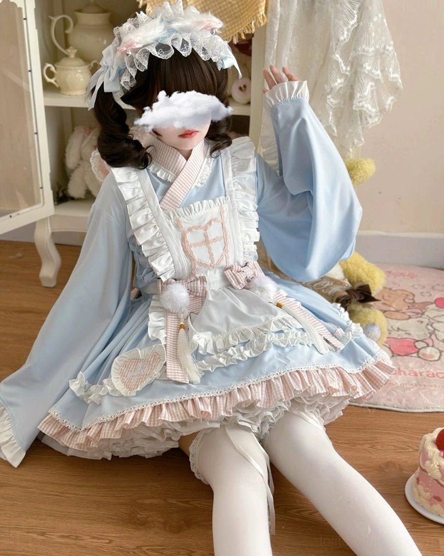 Sweet Meow maid lolita dress skirt detail showing heart-shaped plaid patches and lace hem trim construction