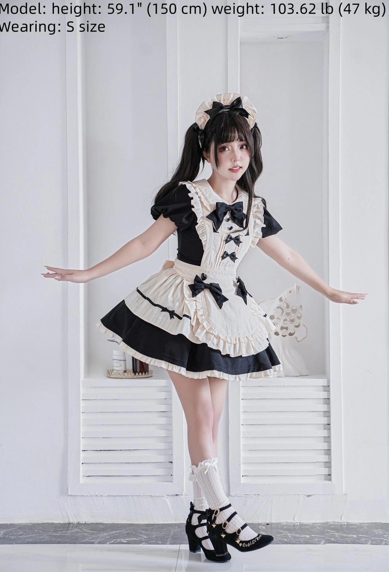 Real model wearing size S enchanted maid lolita OP dress with cat ear headbow black platform sandals and white socks standing on indoor balcony
