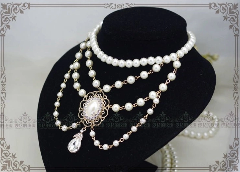 Manor Ball II vintage cameo necklace color variant comparison showing white pearl and black pearl options with golden brown portrait sculpture together