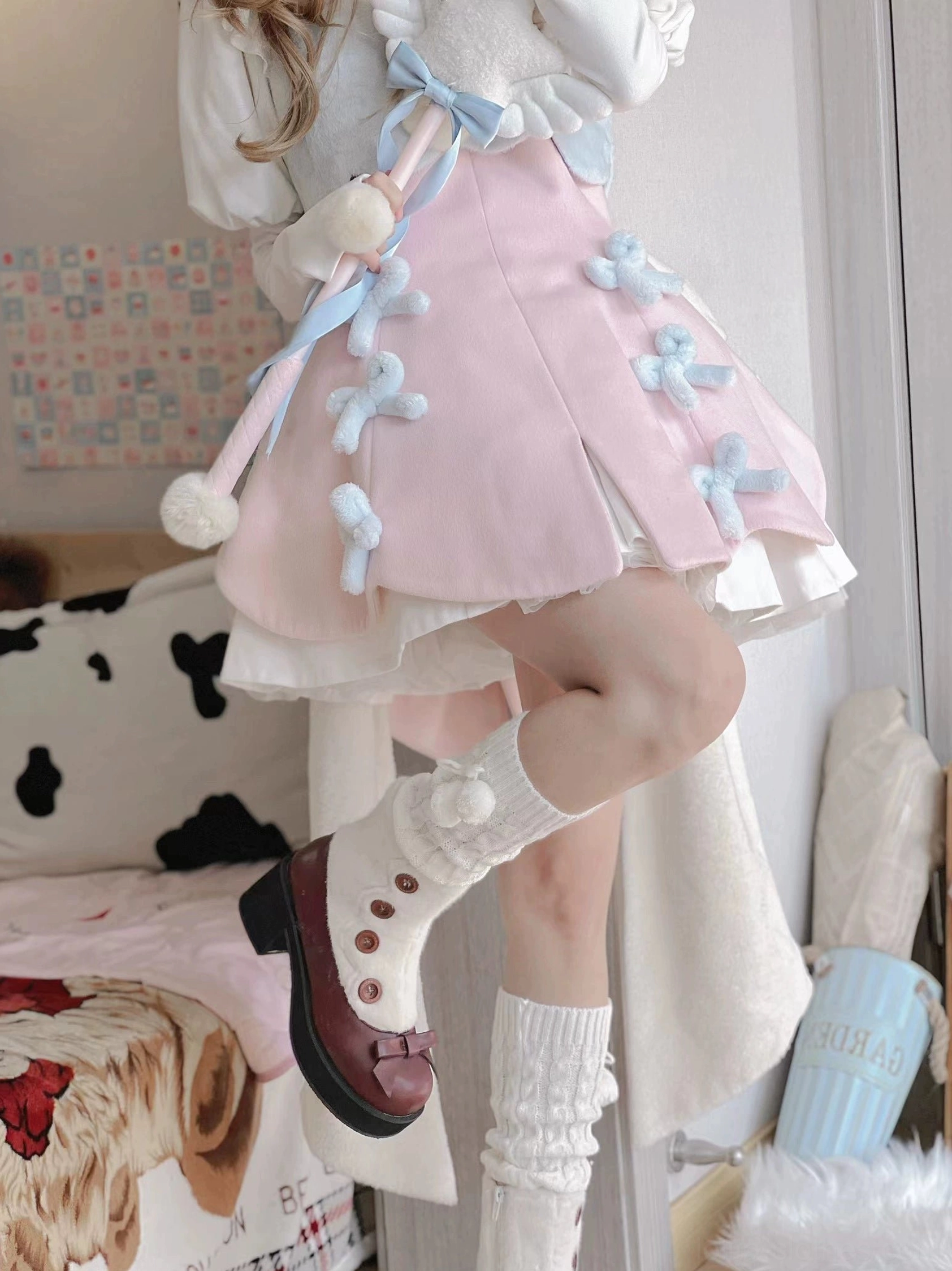 Mary jane boots top view showing round toe bow detail button embellishments faux fur collar opening