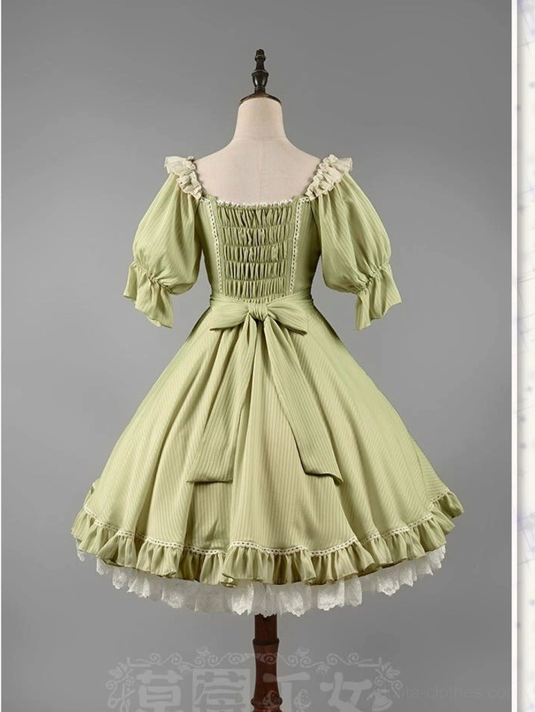 Matcha green lolita OP dress back view mannequin display shirred design puff sleeves waist bow ruffled lace hem construction details