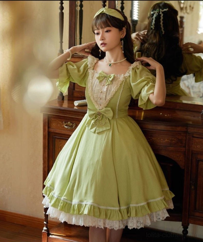 Matcha green sweet lolita OP dress full-body front view puff sleeves lace bow ruffled hem A-line flared skirt dressing room scene