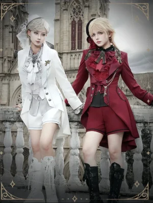 Matching couple Ouji Lolita fashion tailcoat suits white and wine red colors front view on vintage stone balcony with church architecture backdrop
