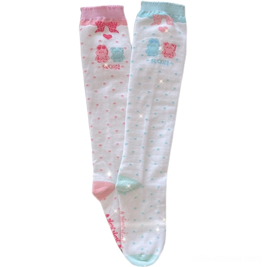 Matching pair of pastel lolita calf socks in pink and blue with ruffled cuffs heart dot patterns and cute bear bunny cartoon graphics
