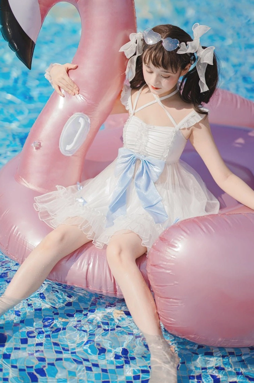 Mermaid inspired lolita swimwear one-piece front sitting view leaning flamingo float ruched bust design cross spaghetti straps layered ruffled tulle