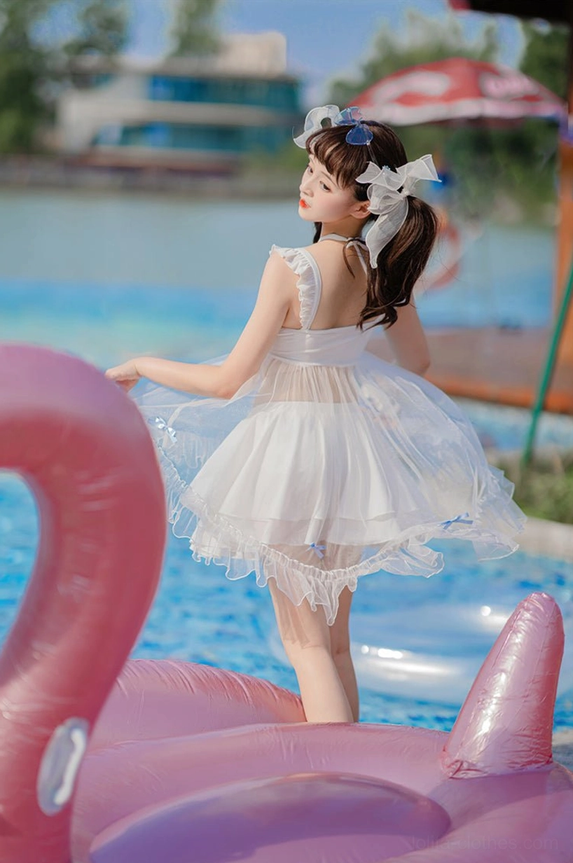 Mermaid lolita swimwear back view open back design ruffled tulle hem twin tails white hair bows standing shallow pool water