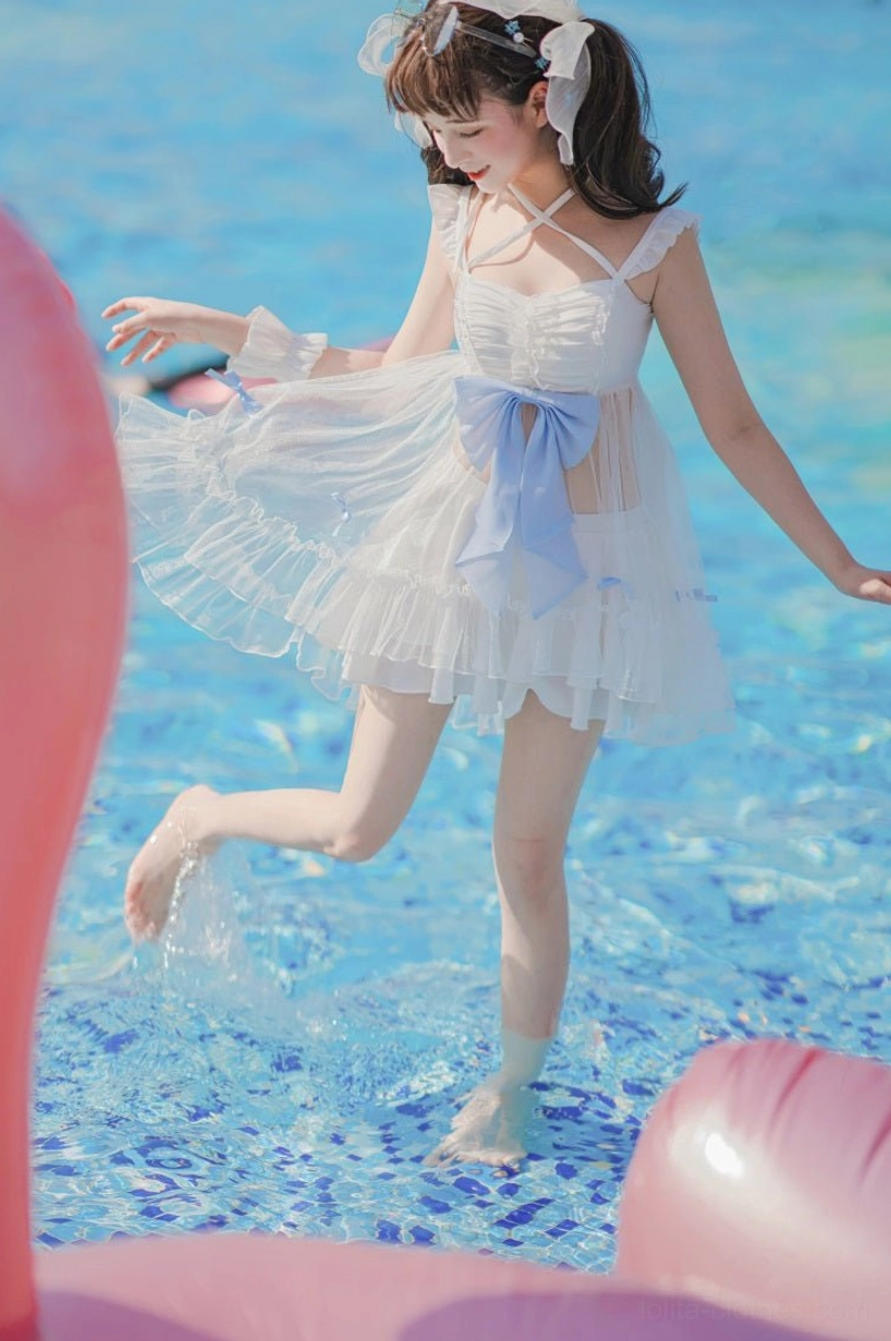 Mermaid lolita dress details close-up milk silk lining polyamide glitter tulle overlay quality craftsmanship heart-shaped padding fine mesh