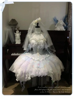 Ocean-themed wedding Lolita JSK dress with bridal veil displayed on dress form showing white lace overlay and beaded embellishments