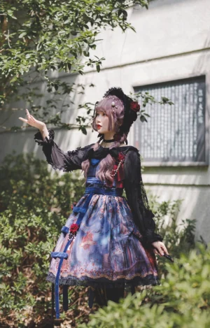 Midnight Magic Gothic Lolita JSK Dress - Three-Quarter Side View Showcasing Vintage Print Skirt, Detachable Blue Ribbon Decorations, and Ruffled Black Lace Hem