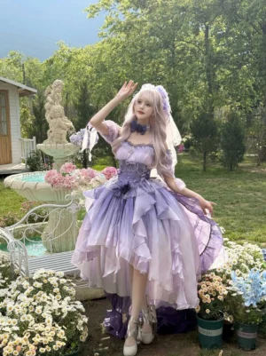 Gradient purple wedding Lolita JSK dress set with off-shoulder design and high-low ruffled hem, fishbone corset waist, displayed in outdoor garden with fountain