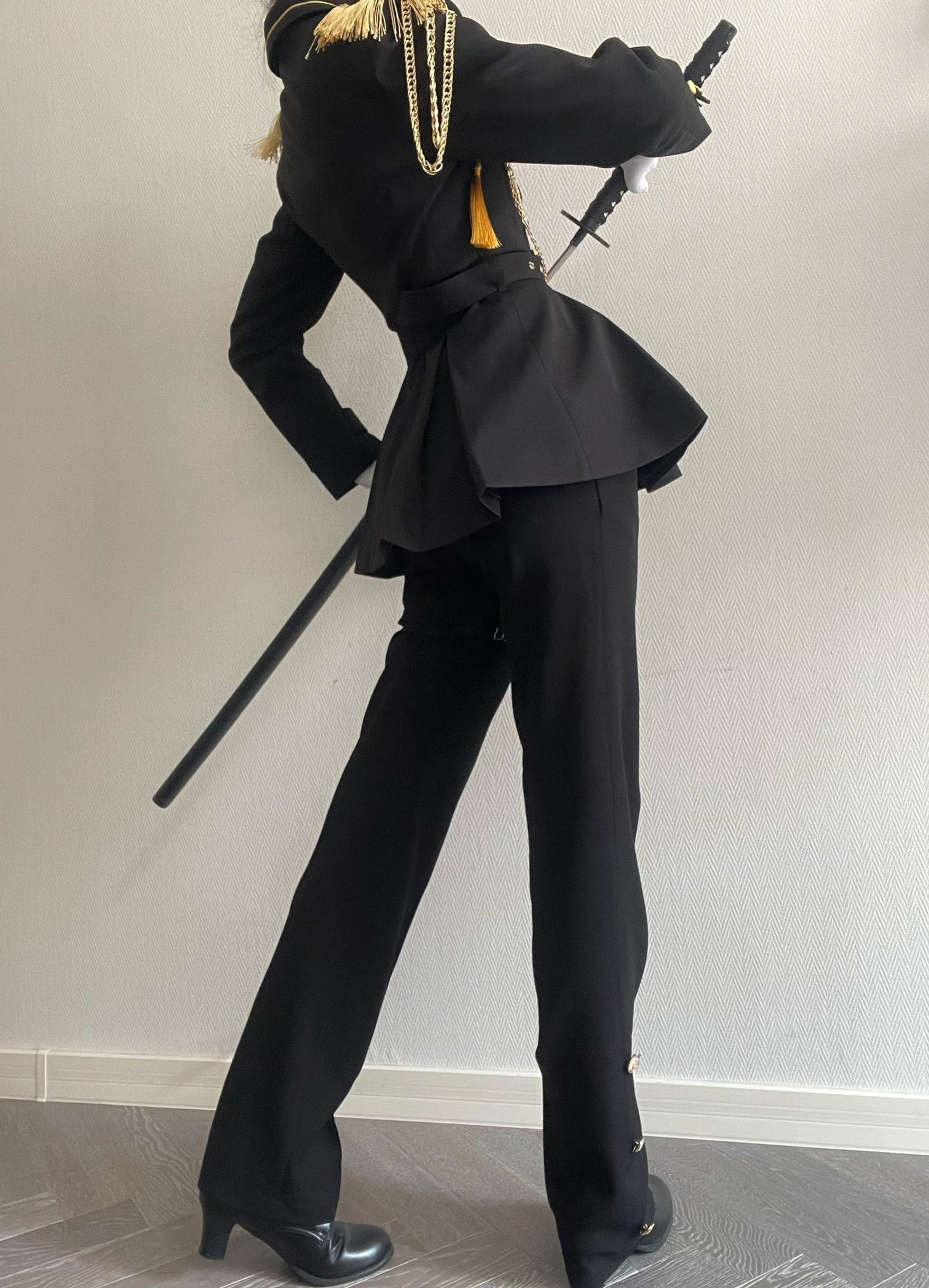 Military Ouji lolita cape solo view showing sweeping hemline gold trimmings buttoned shoulders and attachment mechanism