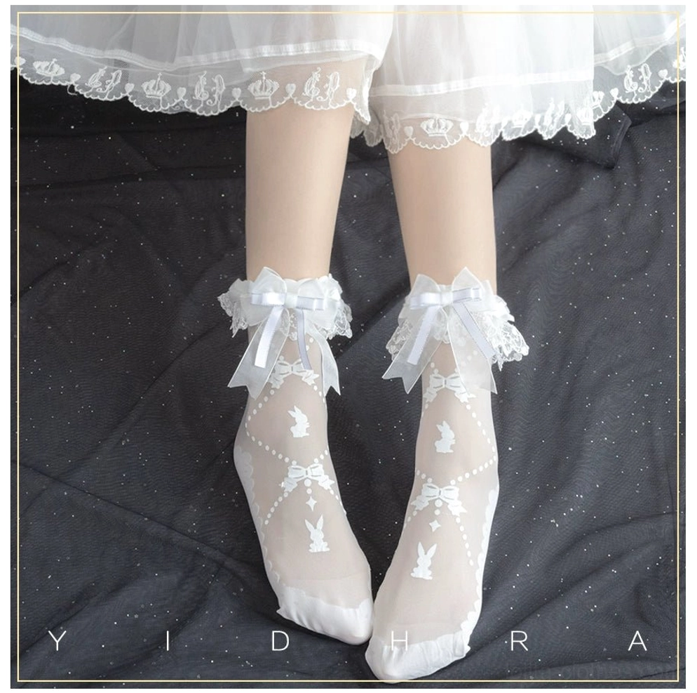 Milk candy rabbit white lolita ankle socks flat lay view showing detachable lace ruffle cuff with satin bow and bunny jacquard patterns on sheer fabric