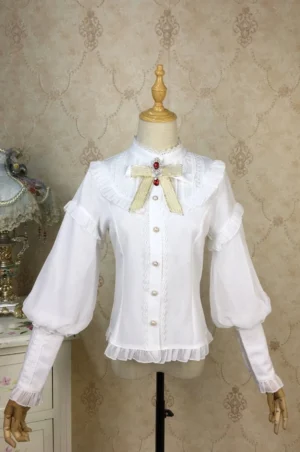 Milk white Lolita bishop sleeve blouse with lace yoke stand collar and detachable gemstone bow brooch on dress form